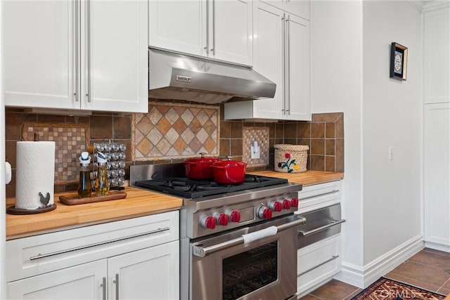 1377 Knoll Rd, Redlands, CA 92373 - kitchen featuring designer stove, under cabinet range hood, butcher block countertops, tasteful backsplash, and a warming drawer
