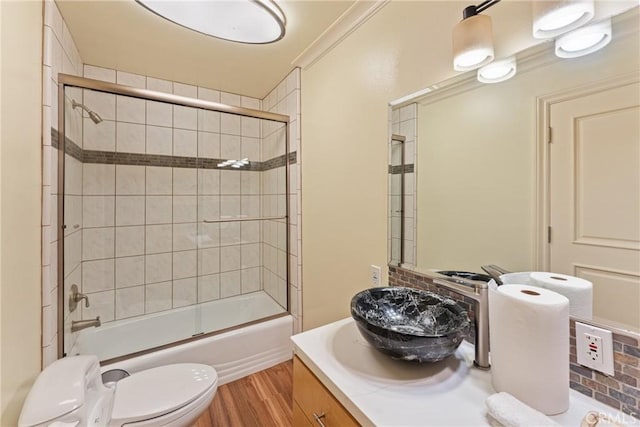 1377 Knoll Rd, Redlands, CA 92373 - bathroom featuring vanity, wood finished floors, and bath / shower combo with glass door