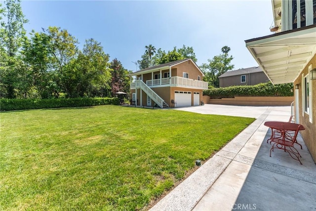 1377 Knoll Rd, Redlands, CA 92373 - view of green lawn with stairs, an attached garage, and driveway