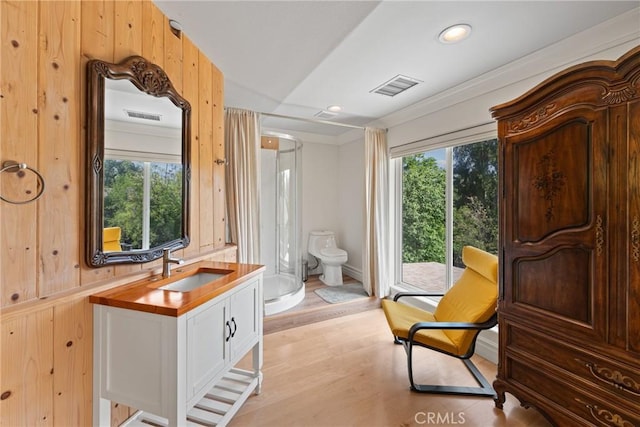 1377 Knoll Rd, Redlands, CA 92373 - full bathroom featuring plenty of natural light, wood finished floors, vanity, recessed lighting, and a shower