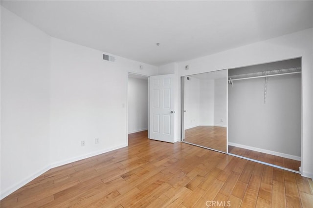 1995 Las Colinas Cir Unit 301, Corona, CA 92879 - unfurnished bedroom with light wood-style floors and a closet