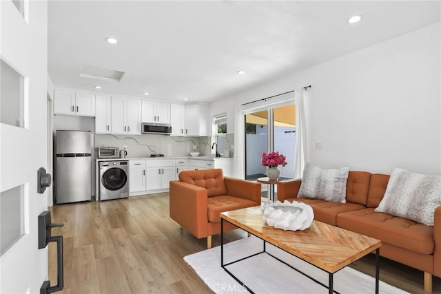 2129 N Pepper St, Burbank, CA 91505 - living area with washer / clothes dryer, light wood-type flooring, and recessed lighting