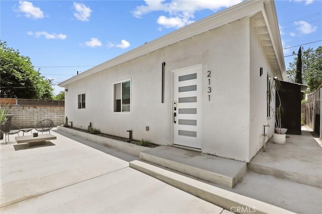 2129 N Pepper St, Burbank, CA 91505 - view of side of property featuring stucco siding and a patio