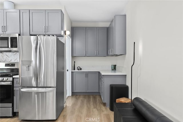 2129 N Pepper St, Burbank, CA 91505 - kitchen with stainless steel appliances, gray cabinetry, and light wood finished floors