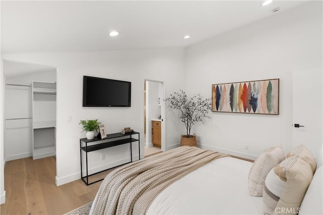 2796 Cibola Ave, Costa Mesa, CA 92626 - bedroom with vaulted ceiling, a spacious closet, light wood finished floors, recessed lighting, and baseboards