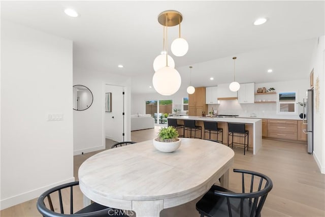 2796 Cibola Ave, Costa Mesa, CA 92626 - dining room with recessed lighting, light wood-style flooring, and baseboards