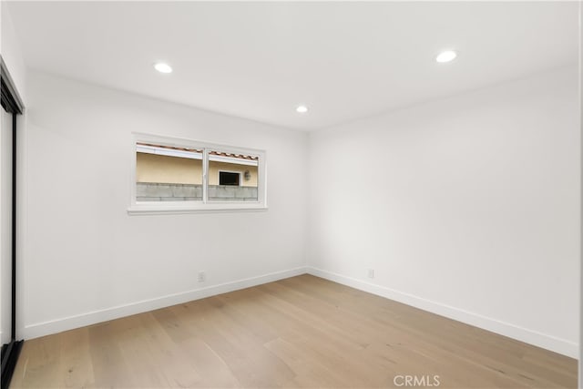 2796 Cibola Ave, Costa Mesa, CA 92626 - empty room featuring light wood finished floors, baseboards, and recessed lighting
