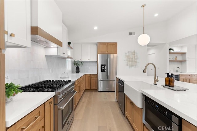 2796 Cibola Ave, Costa Mesa, CA 92626 - kitchen featuring appliances with stainless steel finishes, a sink, wall chimney range hood, open shelves, and lofted ceiling