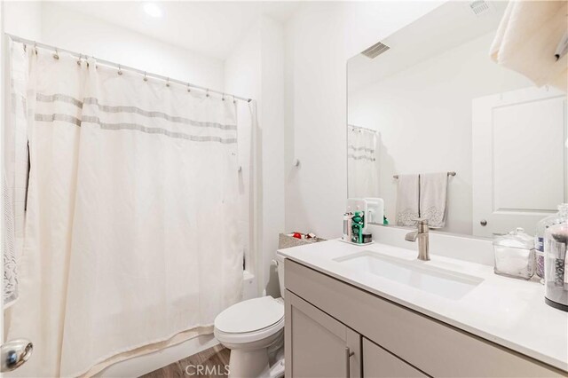 29485 Whitewood St, Menifee, CA 92584 - full bath with vanity, shower / bath combination with curtain, and wood finished floors