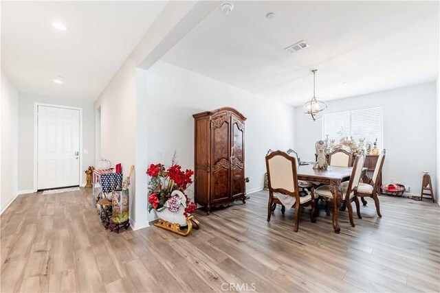 29485 Whitewood St, Menifee, CA 92584 - dining area with light wood-type flooring, a chandelier, and recessed lighting