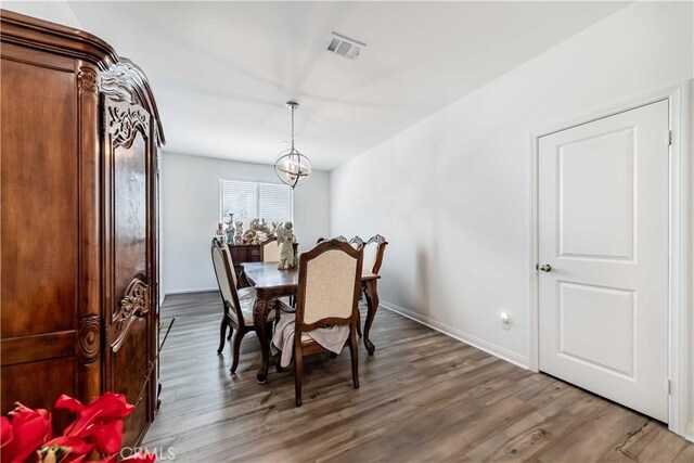 29485 Whitewood St, Menifee, CA 92584 - dining area featuring wood finished floors and a chandelier