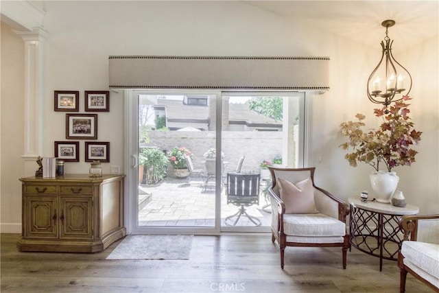 425 Old Ranch Rd, Seal Beach, CA 90740 - living area featuring plenty of natural light, wood finished floors, decorative columns, and baseboards