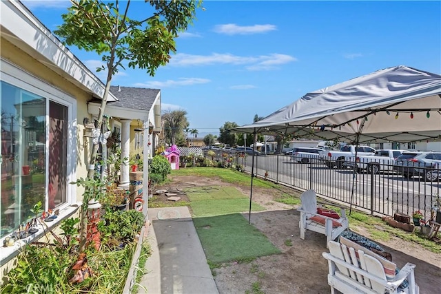 2427 Chanslor St, Pomona, CA 91766 - view of yard featuring a carport and a patio area