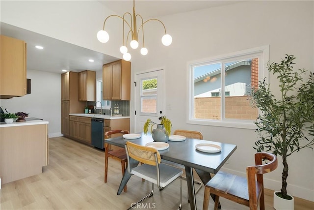 1994 11th St, La Verne, CA 91750 - dining area with light wood-style flooring, a chandelier, recessed lighting, and a towering ceiling