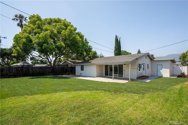 1994 11th St, La Verne, CA 91750 - back of house with a patio area, a fenced backyard, and stucco siding
