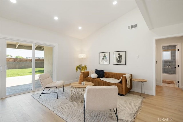 1994 11th St, La Verne, CA 91750 - living area featuring lofted ceiling, light wood-style flooring, and recessed lighting