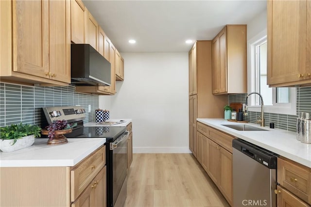 1994 11th St, La Verne, CA 91750 - kitchen featuring stainless steel appliances, light wood finished floors, decorative backsplash, recessed lighting, and light countertops