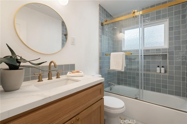 1994 11th St, La Verne, CA 91750 - bathroom featuring vanity, tasteful backsplash, and bath / shower combo with glass door