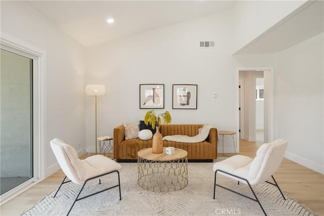 1994 11th St, La Verne, CA 91750 - living room with light wood finished floors, recessed lighting, and lofted ceiling