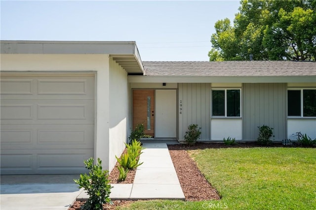 1994 11th St, La Verne, CA 91750 - entrance to property with a garage, a yard, roof with shingles, board and batten siding, and concrete driveway
