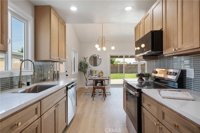 1994 11th St, La Verne, CA 91750 - kitchen featuring stainless steel appliances, backsplash, light wood-style floors, recessed lighting, and pendant lighting
