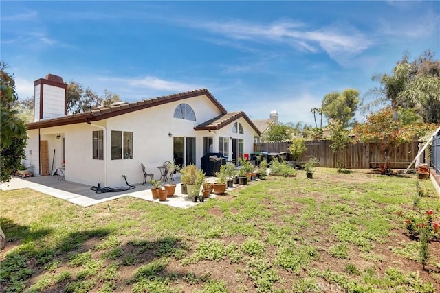 41555 Avenida De La Reina, Temecula, CA 92592 - rear view of property with a fenced backyard, a chimney, a patio area, and stucco siding
