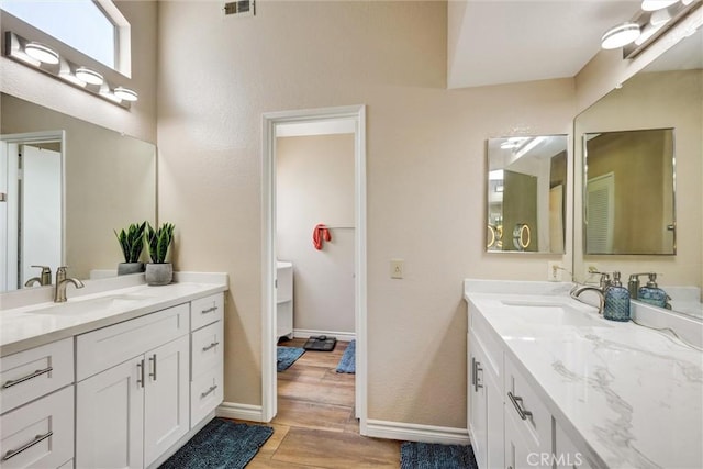 41555 Avenida De La Reina, Temecula, CA 92592 - bathroom featuring two vanities and wood finished floors