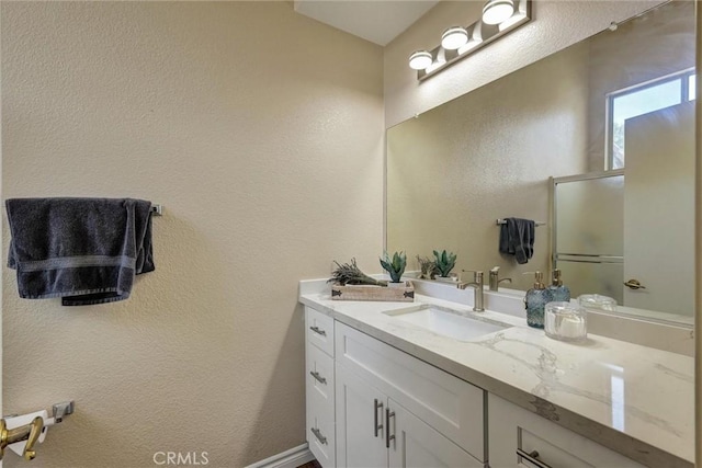 41555 Avenida De La Reina, Temecula, CA 92592 - bathroom with vanity, a textured wall, and an enclosed shower