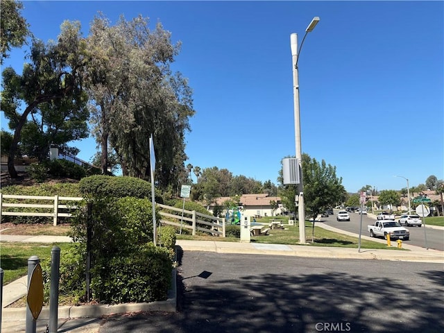 41555 Avenida De La Reina, Temecula, CA 92592 - view of asphalt road with traffic signs, sidewalks, curbs, and street lighting