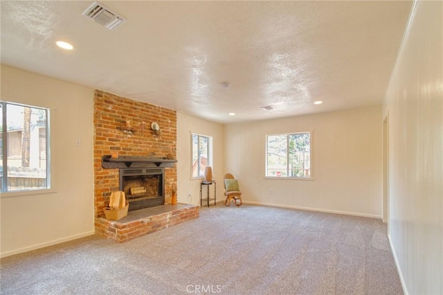 1131 Apple Ave, Wrightwood, CA 92397 - unfurnished living room with a brick fireplace, carpet floors, and recessed lighting