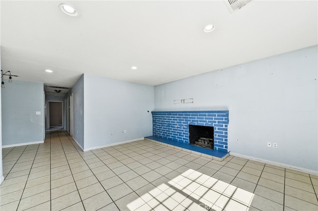 5294 Yosemite Dr, San Bernardino, CA 92407 - unfurnished living room featuring a tile fireplace, recessed lighting, and light tile patterned floors