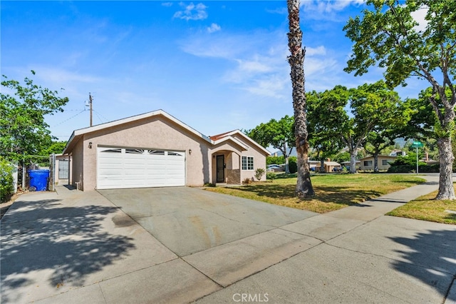 5294 Yosemite Dr, San Bernardino, CA 92407 - ranch-style home featuring an attached garage, driveway, and stucco siding