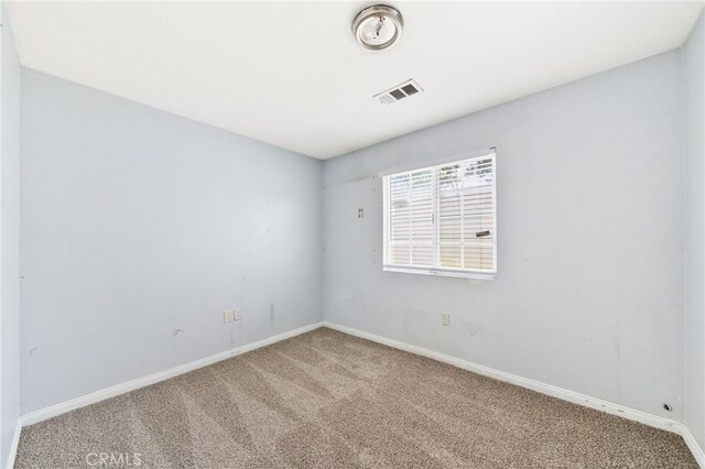 5294 Yosemite Dr, San Bernardino, CA 92407 - empty room featuring carpet and baseboards