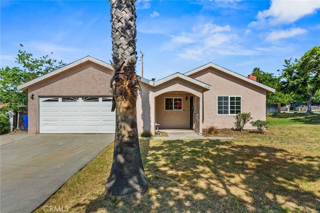 5294 Yosemite Dr, San Bernardino, CA 92407 - single story home featuring stucco siding, driveway, an attached garage, and a front lawn