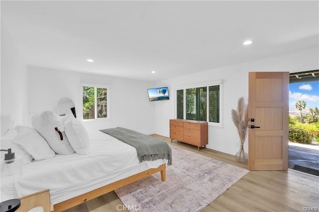 1923 Hollyvista, Los Angeles, CA 90027 - bedroom featuring multiple windows, light wood finished floors, and recessed lighting