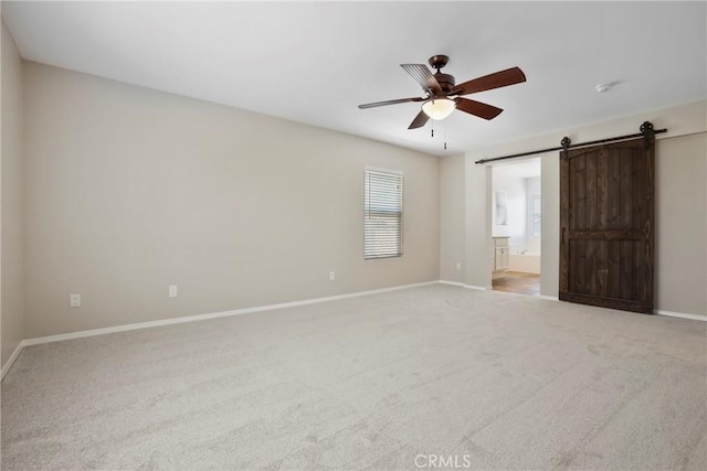 31713 Pompei Ln, Winchester, CA 92596 - unfurnished bedroom featuring a barn door, carpet, ensuite bath, and ceiling fan
