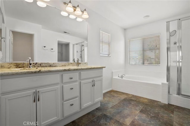 31713 Pompei Ln, Winchester, CA 92596 - bathroom featuring double vanity, a stall shower, a garden tub, and stone finish flooring