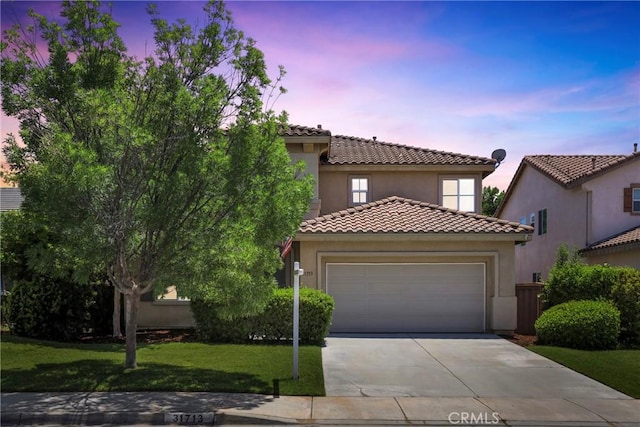 31713 Pompei Ln, Winchester, CA 92596 - mediterranean / spanish-style home featuring concrete driveway, a tile roof, a garage, stucco siding, and a front yard