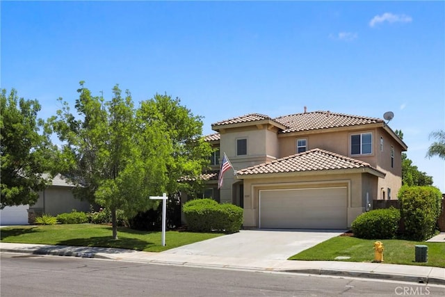 31713 Pompei Ln, Winchester, CA 92596 - view of front facade featuring an attached garage, concrete driveway, a front lawn, stucco siding, and a tile roof