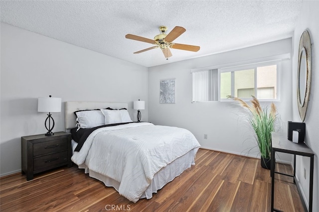 12562 Montecito Rd Unit 3, Seal Beach, CA 90740 - bedroom featuring dark wood-style flooring, a textured ceiling, ceiling fan, and baseboards