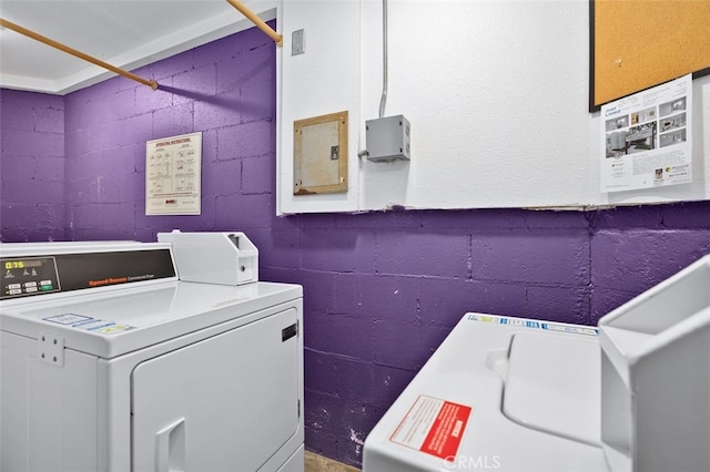 12562 Montecito Rd Unit 3, Seal Beach, CA 90740 - communal laundry room featuring concrete block wall and washer and dryer