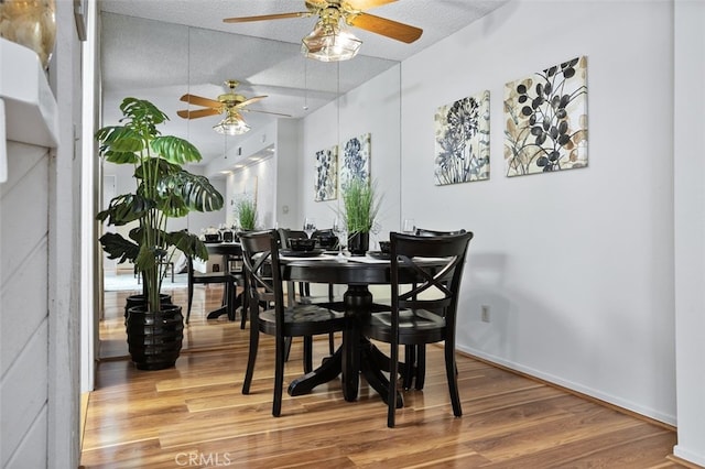 12562 Montecito Rd Unit 3, Seal Beach, CA 90740 - dining area with a ceiling fan, wood finished floors, a textured ceiling, and baseboards