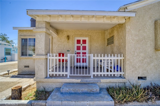 503 California Ave, Needles, CA 92363 - property entrance with crawl space and stucco siding