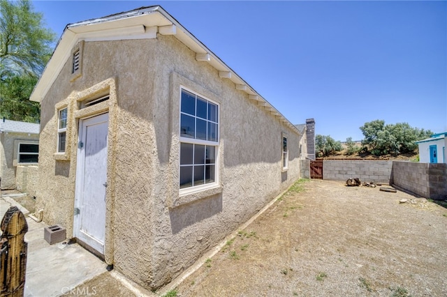 503 California Ave, Needles, CA 92363 - view of side of home with stucco siding