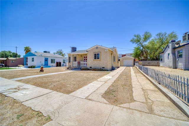 503 California Ave, Needles, CA 92363 - bungalow-style house with a porch, driveway, an outdoor structure, a garage, and crawl space
