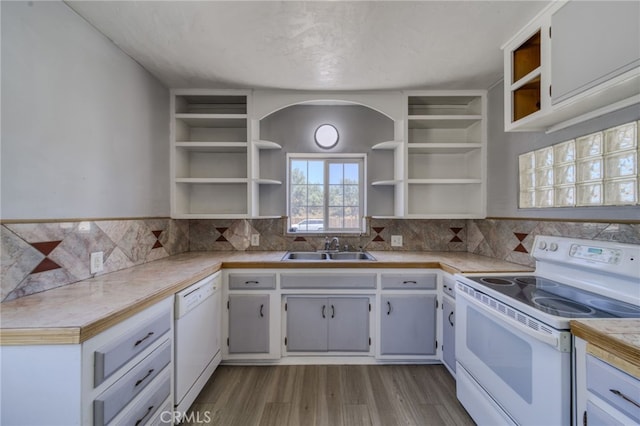 503 California Ave, Needles, CA 92363 - kitchen with white appliances, open shelves, a sink, and light countertops