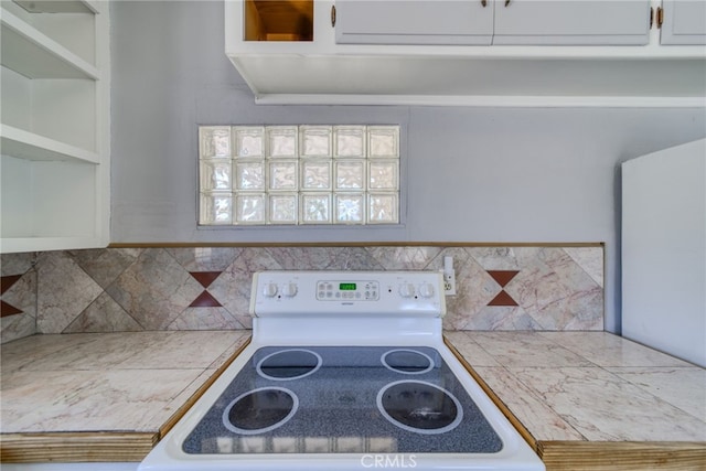503 California Ave, Needles, CA 92363 - kitchen with white electric range, backsplash, and light countertops