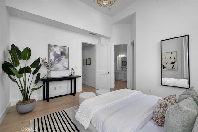 2004 Grant Ave Unit B, Redondo Beach, CA 90278 - bedroom with wood finished floors, a towering ceiling, and ensuite bath