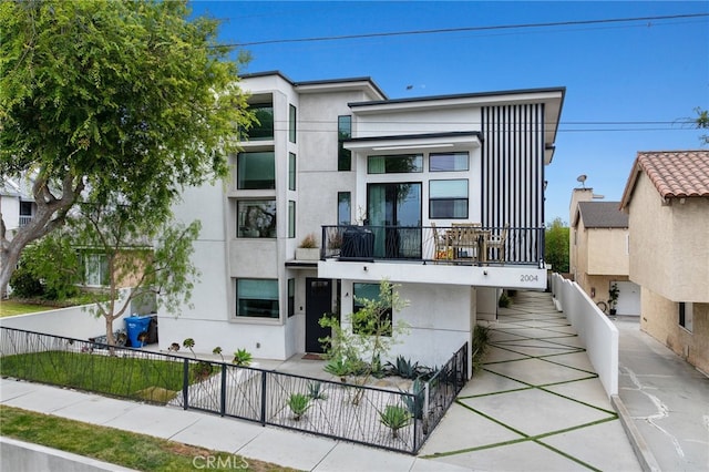 2004 Grant Ave Unit B, Redondo Beach, CA 90278 - contemporary house featuring a balcony and stucco siding