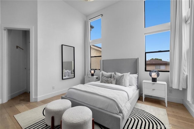 2004 Grant Ave Unit B, Redondo Beach, CA 90278 - bedroom featuring light wood-style floors and a towering ceiling
